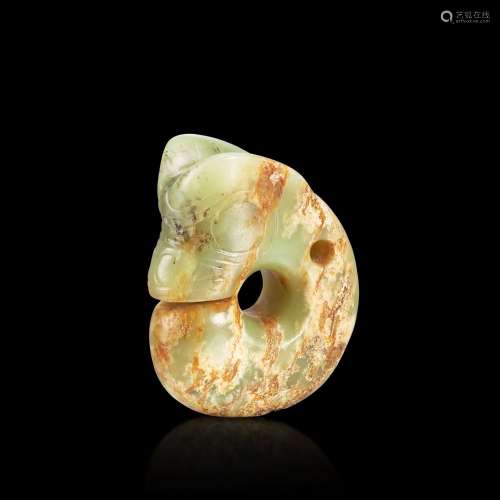<br />
A small celadon and russet jade pig-dragon, Neolithic...