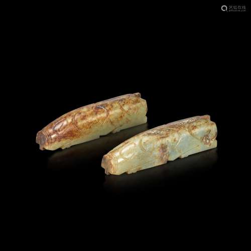 <br />
Two greyish-celadon and russet jade pigs, Western Han...