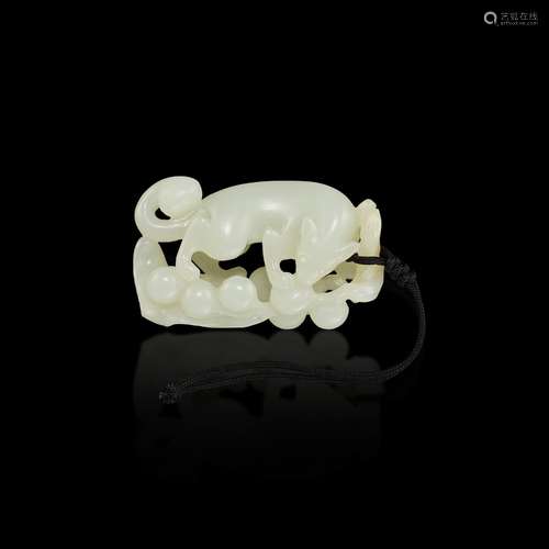 <br />
A white jade openwork 'squirrel and grapes' pendant, ...