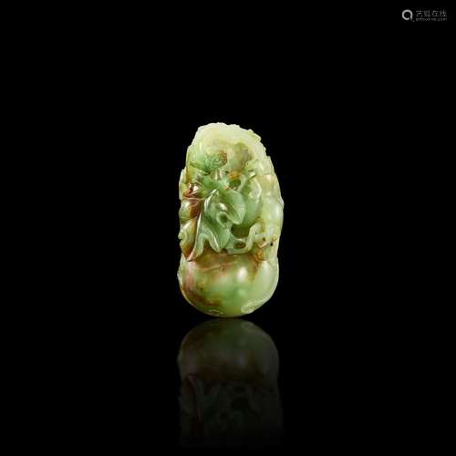 <br />
A pale green and russet jade 'double-gourd' carving, ...