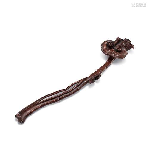 <br />
A carved wood ruyi scepter, Qing dynasty 清 木雕如意