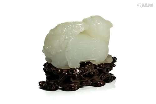 A CHINESE WHITE JADE BEAST W/ ZITAN CARVED STAND