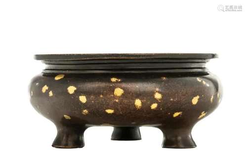 A CHINESE BRONZE GOLD SPLASH TRIPOD CENSER