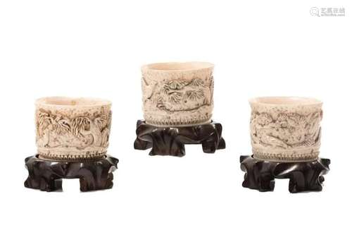 THREE CHINESE NATURAL CARVED WINE CUPS W/ STANDS