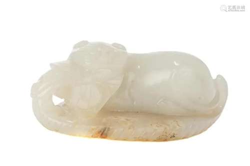 A CHINESE WHITE JADE CARVED CAT ON A LEAF