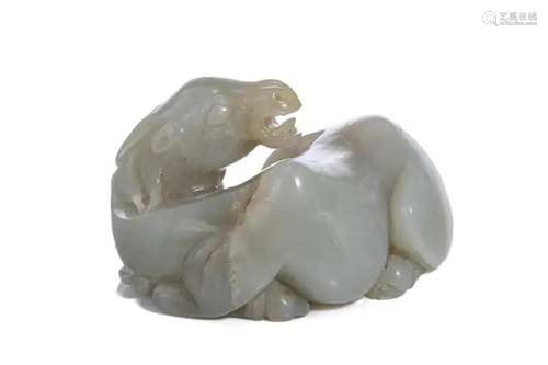 A CHINESE PALE CELADON JADE CARVED RECUMBENT CAMEL