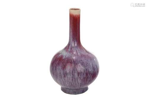 A CHINESE FLAMBE GLAZED PORCELAIN BOTTLE VASE