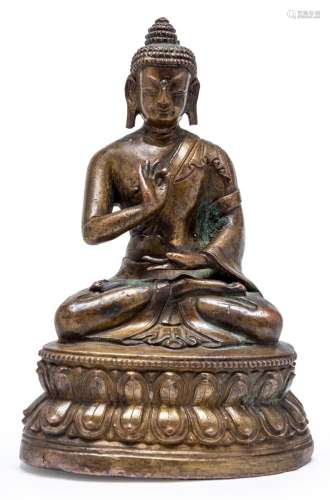A TIBETAN BRONZE SEATED BUDDHA, 18TH CENTURY 16.8cm high