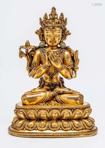 A SINO-TIBETAN GILT BRONZE SEATED FIGURE OF MANJUSHRI, POSSI...