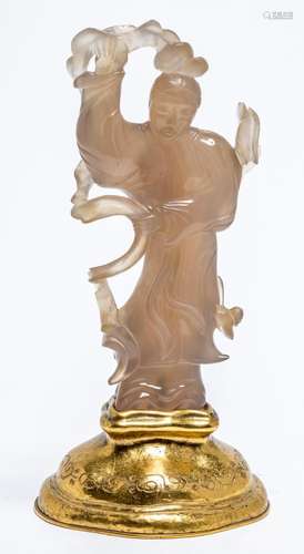 A CHINESE AGATE CARVED FIGURE OF A LADY, LATE QING DYNASTY, ...