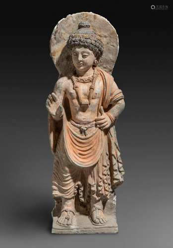 A RARE GANDHARAN POLYCHROMED STUCCO FIGURE OF STANDING BUDDH...