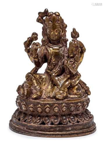 A NEPALESE BRONZED SEATED SHIVA AND PARVATI, CIRCA 16TH CENT...