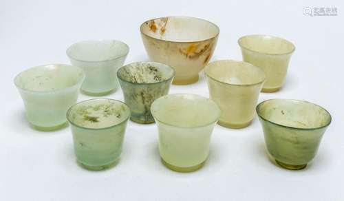 A SET OF NINE CHINESE CELADON JADE CUPS largest 8cm diameter