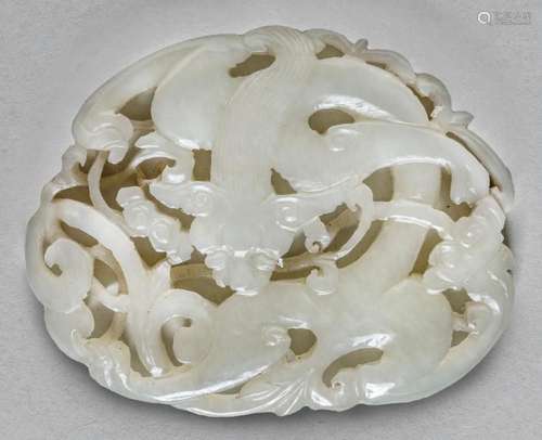 A CHINESE PALE WHITE JADE PENDANT OF A CHILONG, QING DYNASTY...