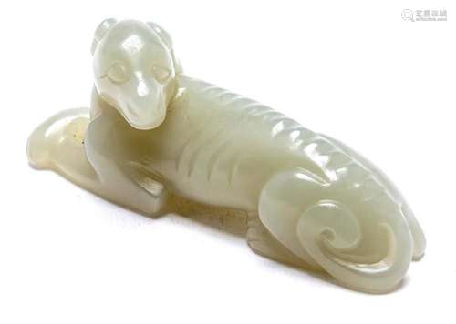 A CHINESE PALE WHITE JADE DOG 6.5cm wide