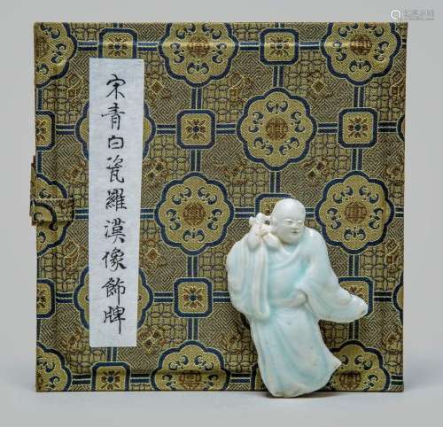 A VERY RARE CHINESE QINGBAI FIGURE OF LUOHAN PLAQUE, SONG DY...