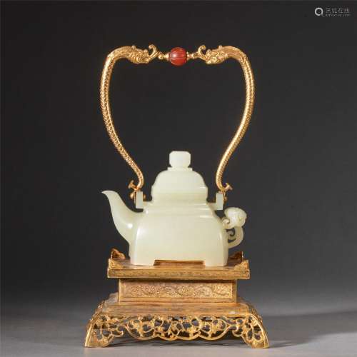 A CHINESE CARVED JADE POT WITH GILDING HANDLE AND STAND