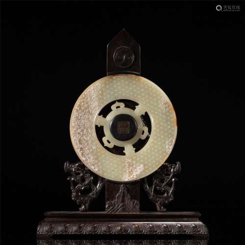 A CHINESE CARVED JADE DISC BI AND HARDWOOD DECORATION