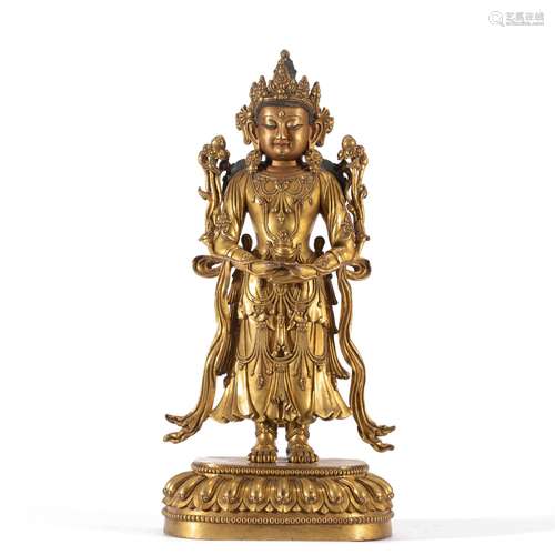 A CHINESE GILT BRONZE STANDING FIGURE OF BUDDHA