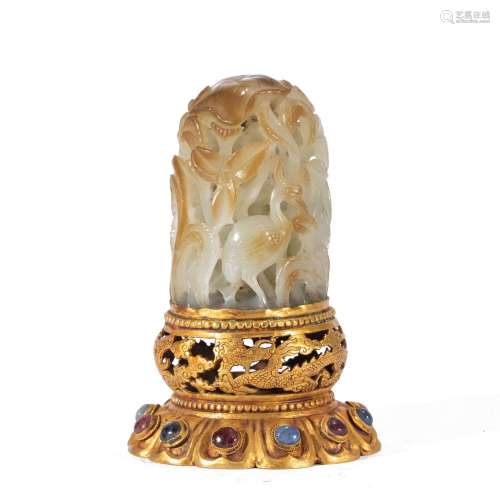 A CHINESE CARVED JADE DECORATION AND GILT STAND