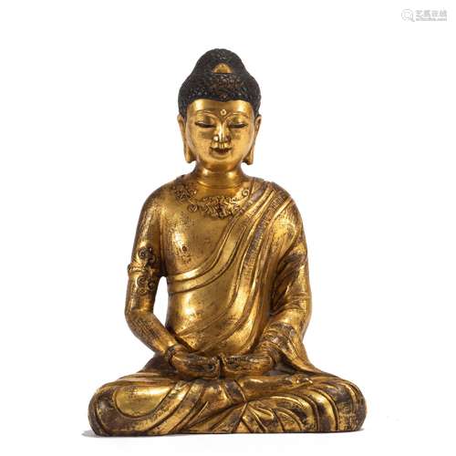 A CHINESE GILT BRONZE SEATED FIGURE OF SHAKYAMUNI