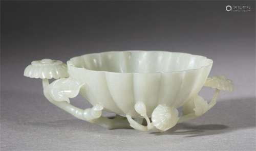 A CHINESE CARVED JADE LOBED WASHER