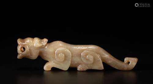 A CHINESE CARVED JADE BEAST
