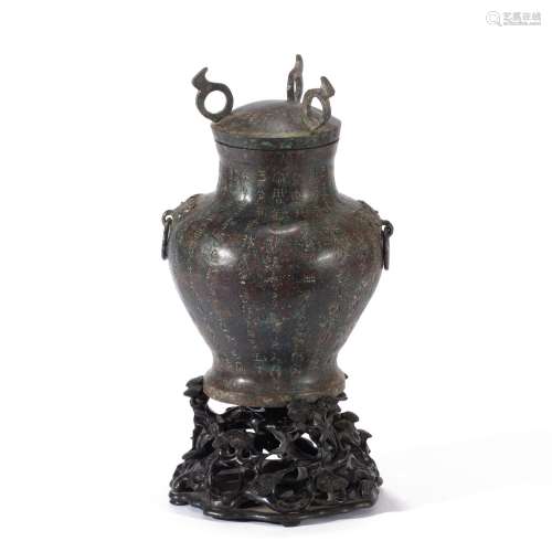 A CHINESE INSCRIBED BRONZE VASE AND COVER