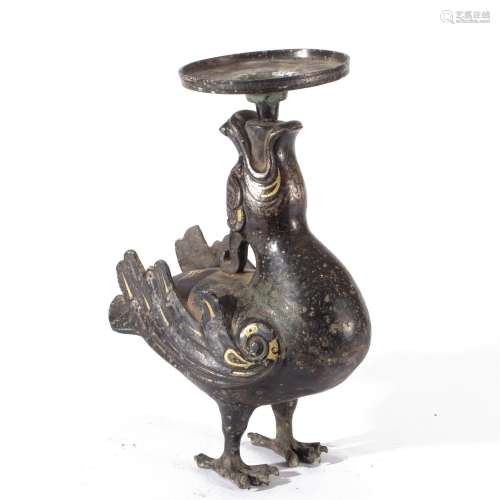 A GOLD AND SILVER DECORATED BRONZE BIRD FORM CANDLE HOLDER