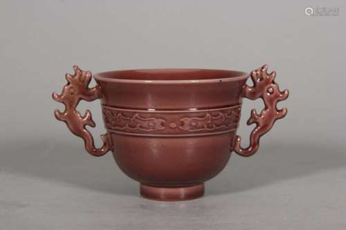 A glazed porcelain cup with dragon shaped ears,Qing Dynasty,...