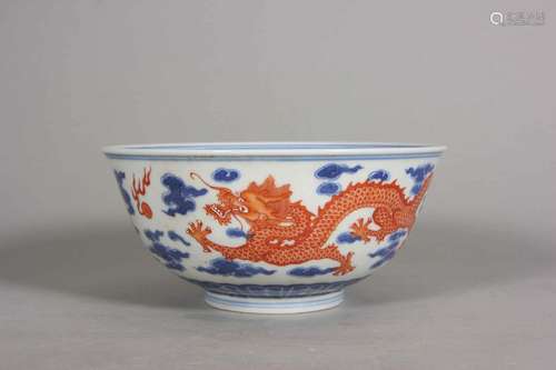 A blue and white iron red dragon porcelain bowl,Qing Dynasty...