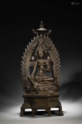 A silver-inlaid copper green tara statue,Fourteenth Century