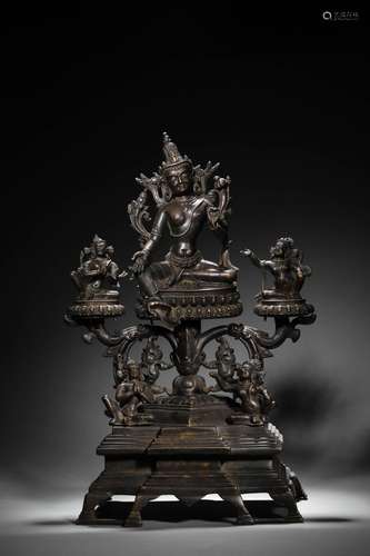 A silver-inlaid copper green tara statue,Fourteenth Century