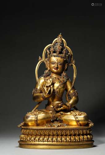 A gem-inlaid gilding copper buddha statue