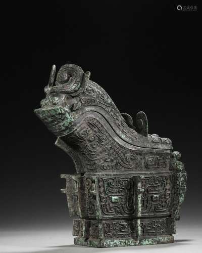 A taotie patterned bronze goat head pot,Han Dynasty,China