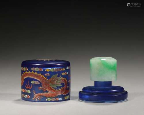 A jadeite thumb ring with dragon painted glass box