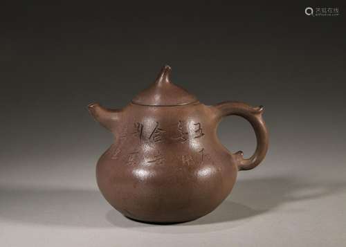 An inscribed gourd shaped zisha clay teapot