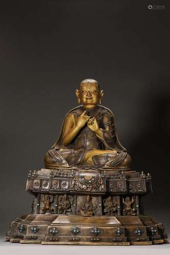 A gilt silver-inlaid copper buddha statue