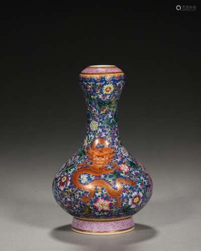 A blue ground famille rose flower and dragon porcelain vase,...