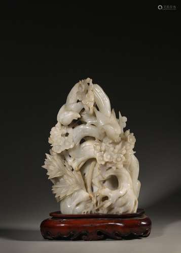 A magpie and plum blossom carved jade ornament,Qing Dynasty,...