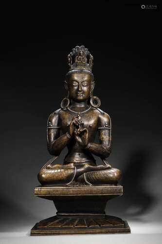 A silver-inlaid copper Vairocana statue