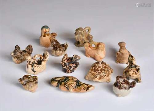 A Group of 13 Archaistic Pottery Ornaments