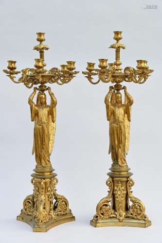 A pair of Gothic Revival bronze candlesticks 'angels' (h 47c...