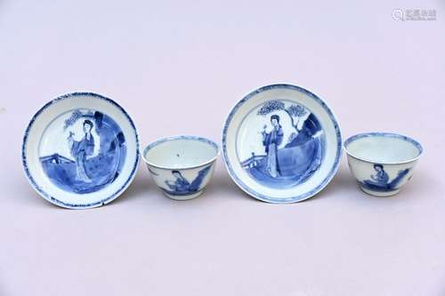 A pair of cups and saucers in Chinese blue and white porcela...