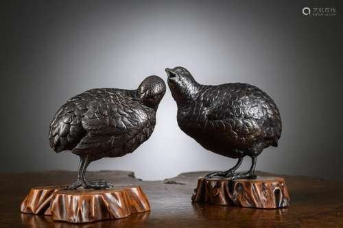 A pair of Japanese bronze okimono's on wooden base 'quails',...