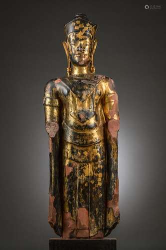 A large sculpture in gilt lacquered sandstone 'standing Budd...