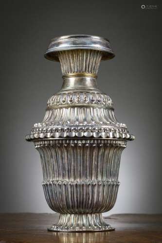 A Tibetan silver vase decorated with citipati (h29cm) (weigh...