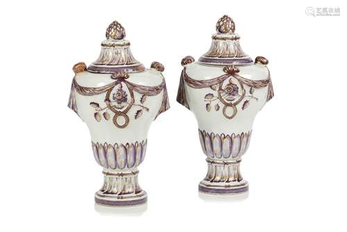 A pair of urns with covers