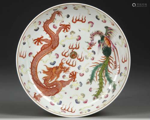 A CHINESE FAMILLE ROSE DRAGON AND PHOENIX DISH 19TH-20TH CEN...