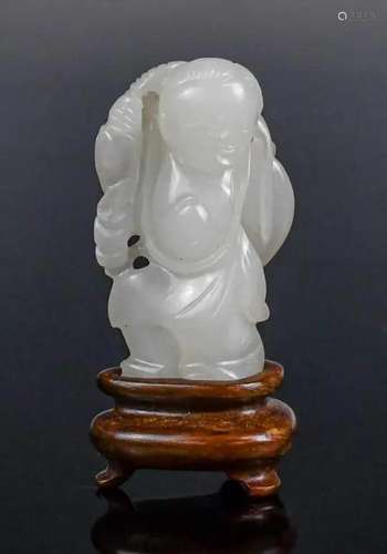 A Carved Jade Boy with Stand Qing